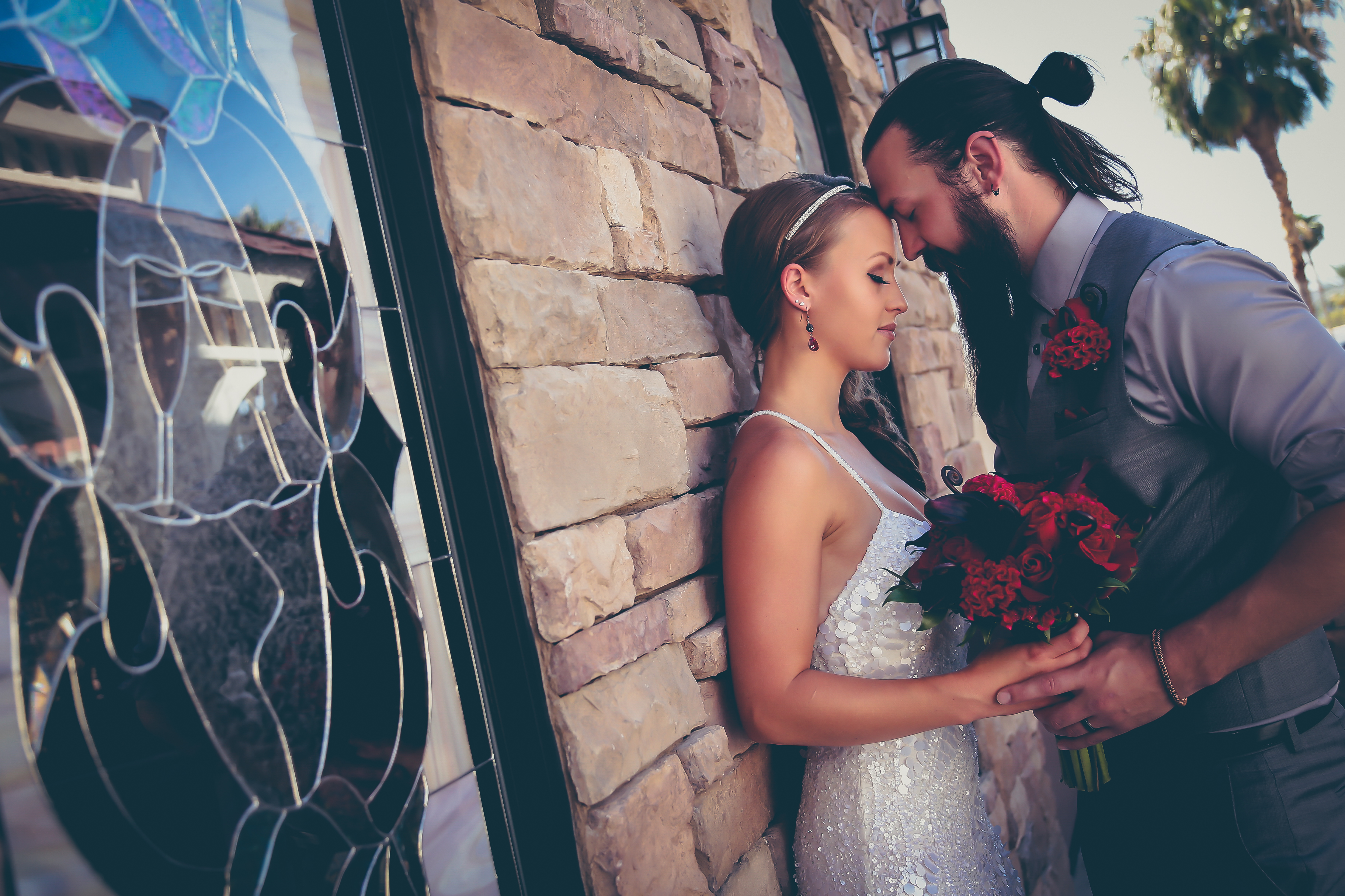Las Vegas wedding chapels - Couple with their foreheads touching and eyes closed feeling the sentiment of newlywed love