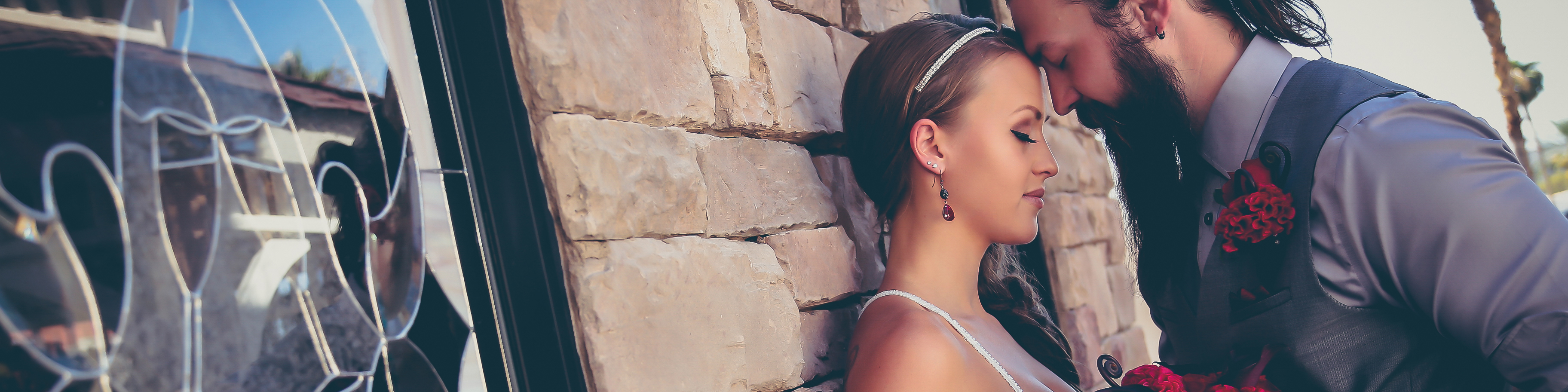 Las Vegas wedding chapels - Couple with their foreheads touching and eyes closed feeling the sentiment of newlywed love