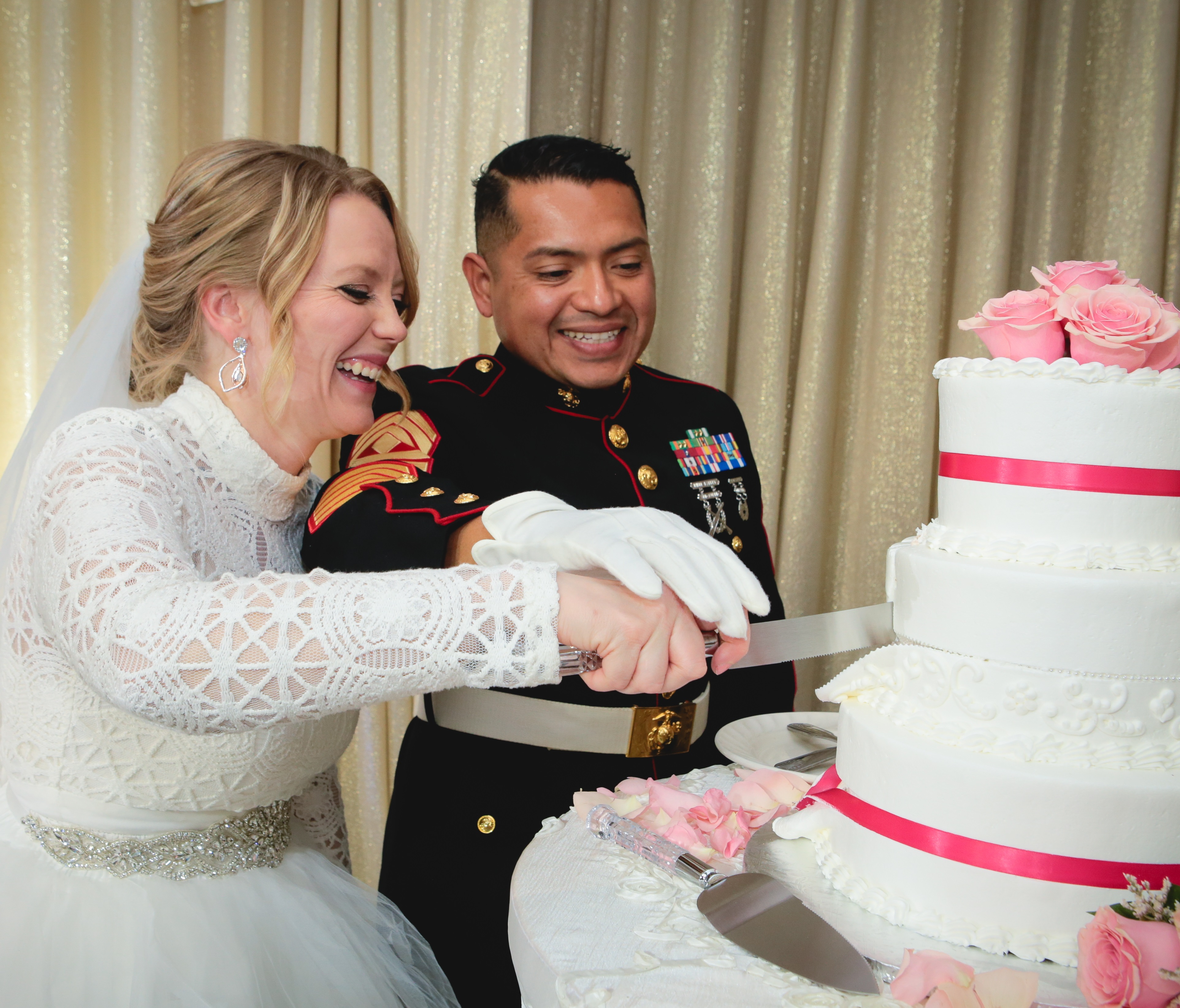 Newlyweds cutting theiir cake at their wedding reception in Vegas