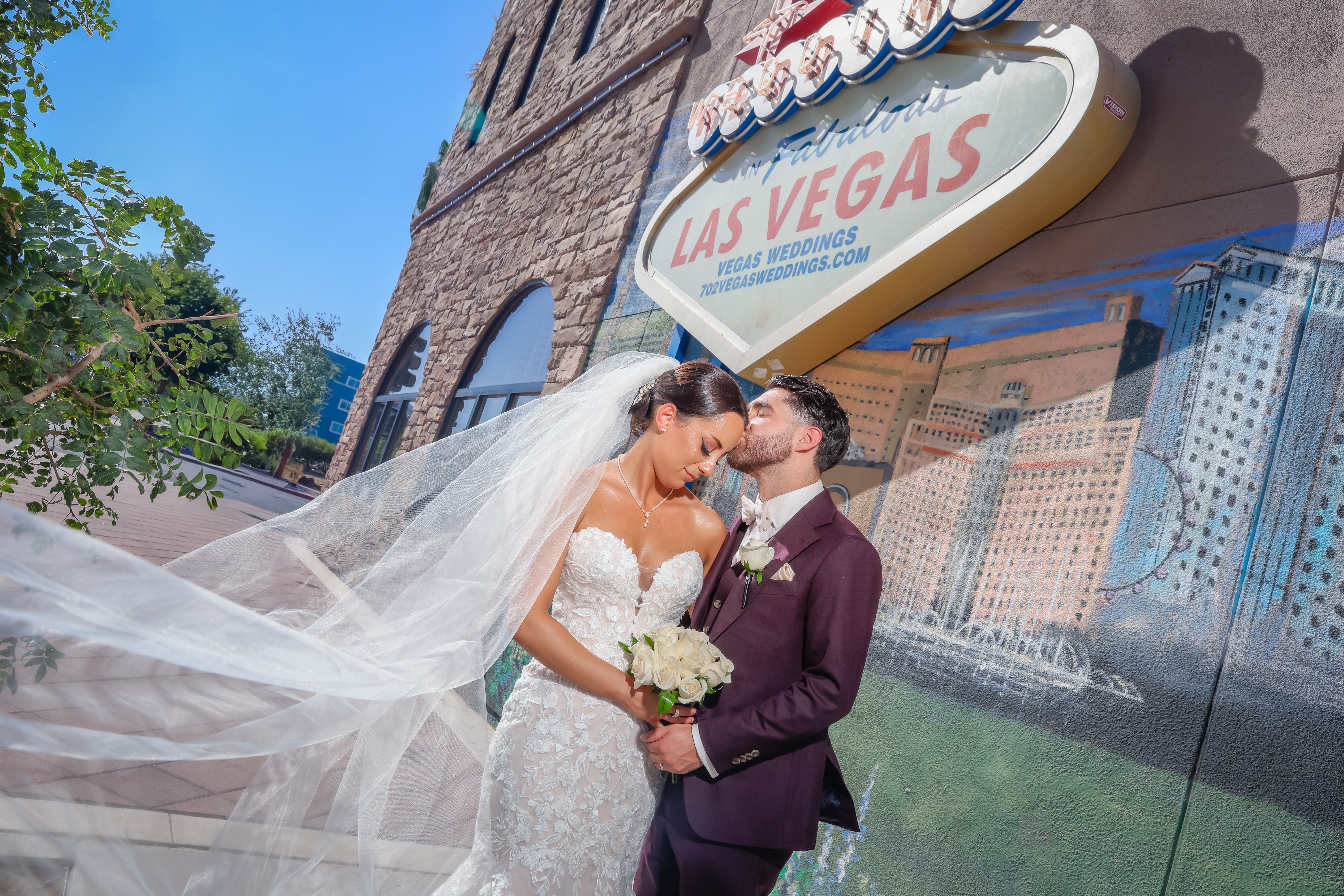 Signature Photo Session - Couple kiss while rose petals fly